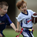 Two boys playing game of flag football at i9 Sports