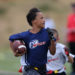 flag football player running with football at i9 sports game