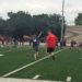 No. 14 Nicholas Habel, who has Down syndrome, takes a victory lap around the field with his uncle and coach, Hans Nielsen. Two i9 Sports teams worked together that day to create a special memory for Nicholas and his mom.