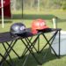 two i9 Sports® helmets displayed on a table
