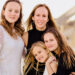 Asia Mape with her three daughters at the beach